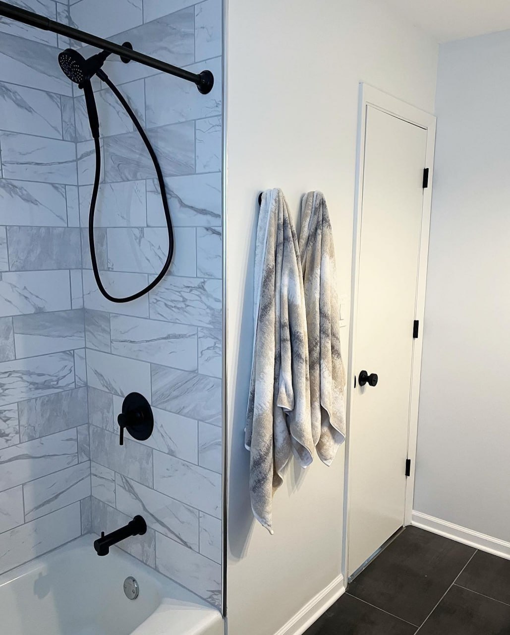 Marble subway tile tub and shower surround
