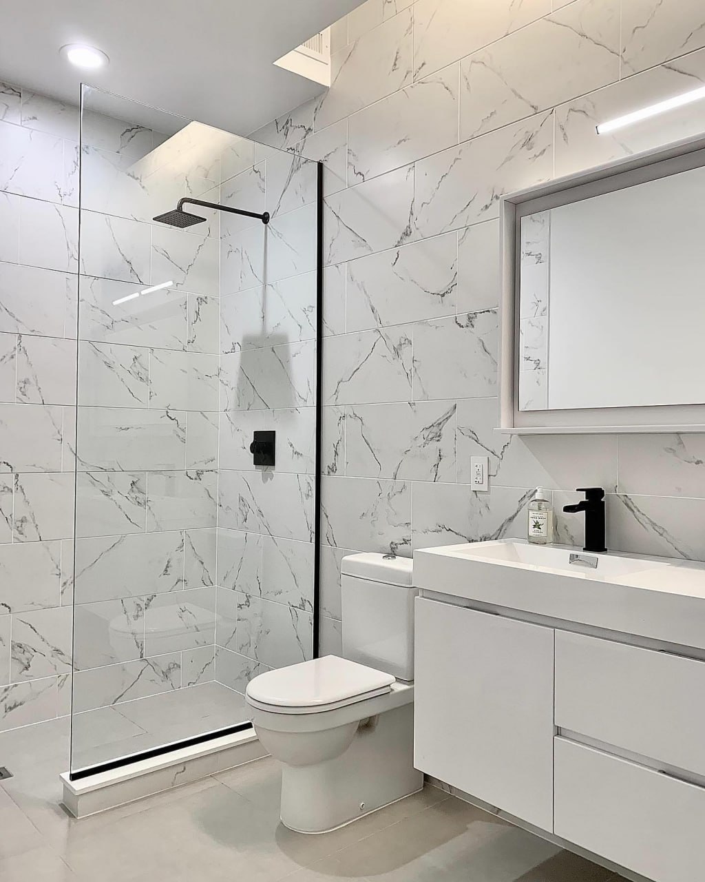 High-end marble bathroom remodel with walk-in shower installed by ReDesignFix in Knox County, TN