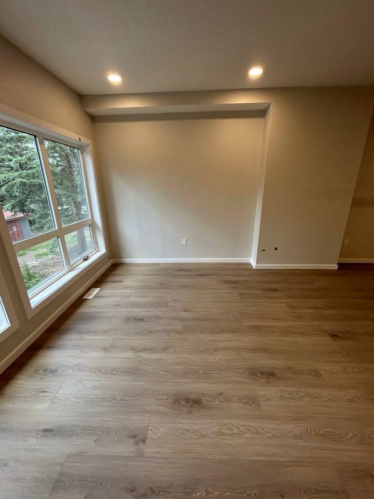Vaulted-ceiling living space with new flooring